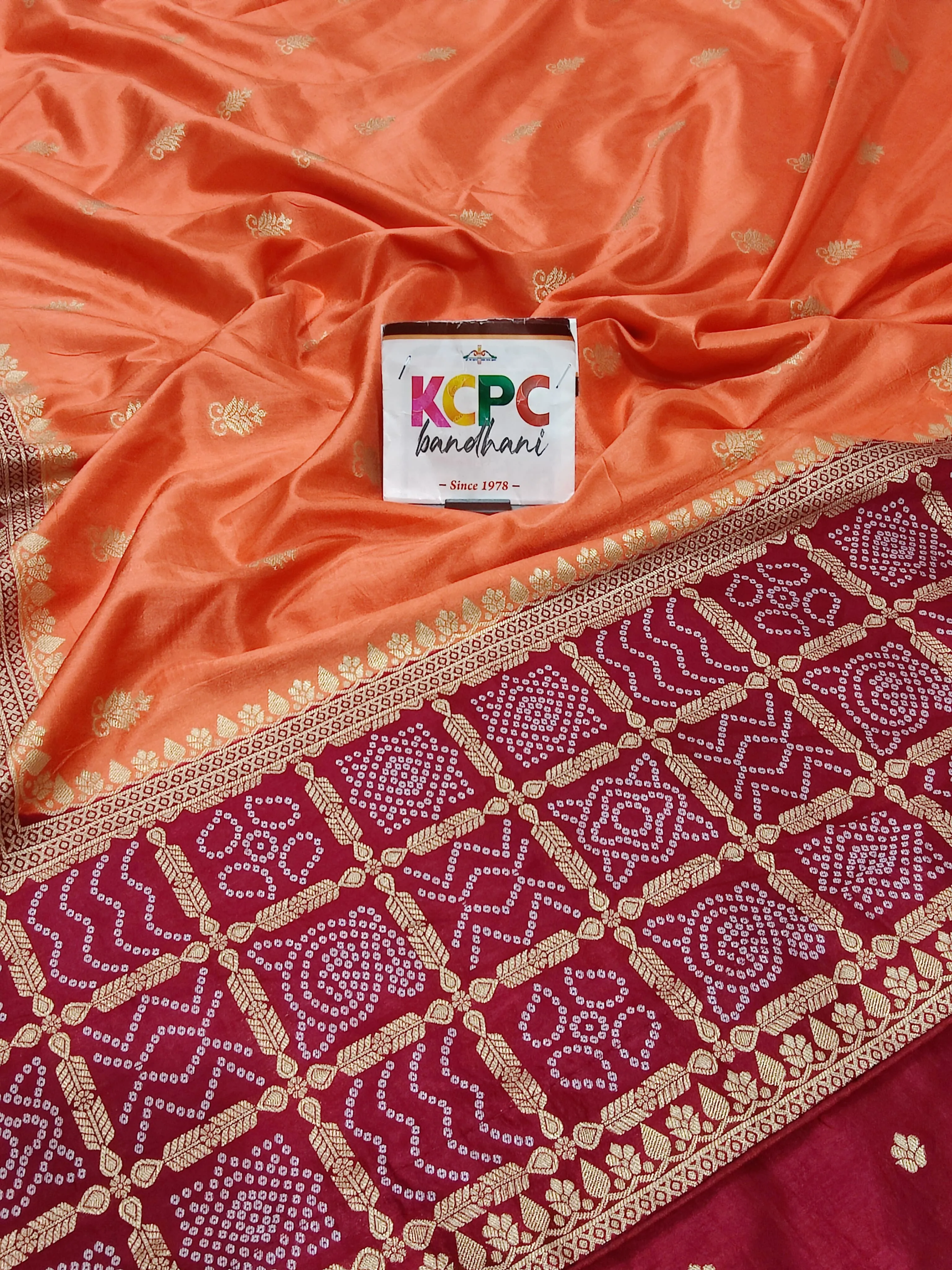 KcPc Exclusive Multicolor Bandhani Semi Gaji Silk Saree with Ghatchola Bandhej Border Orange And Red
